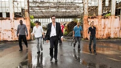 From left, Idris Elba, Oscar Jaenada, Jeffrey Dean Morgan, Chris Evans, Columbus Short and Zoa Saldana star in The Losers.