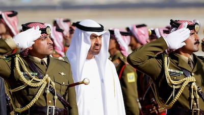 Sheikh Mohamed bin Zayed reviews the Jordan Royal guard of Honour, at Queen Alia Airport in Amman, Jordan. Andre Pain / EPA