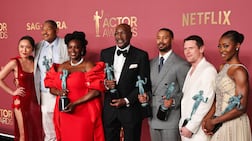 The cast of Sinners with their Outstanding Performance By A Cast In A Motion Picture awards during the Actor Awards. Reuters