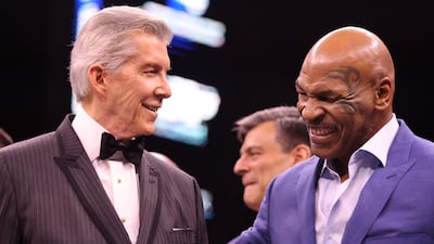 Mike Tyson with ring announcer Michael Buffer before the fight. Reuters