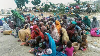 Some of the 700 people who escaped from Boko Haram militants in Monguno, Nigeria, last week. The abductees were forced to work by the insurgents / EPA