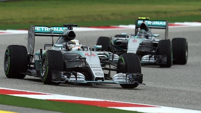 Changing conditions at the Circuit of the Americas made for a challenging race for Lewis Hamilton, left, and Nico Rosberg. Jewel Samad / AFP