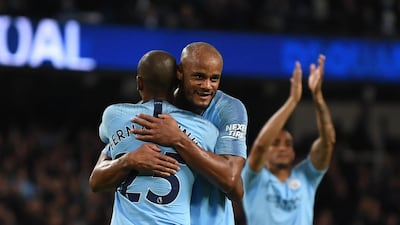 Fernandinho celebrates with Vincent Kompany after scoring City's third goal. Getty