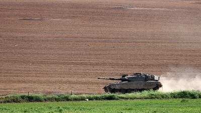 An Israeli tank drives near the border with the northern Gaza Strip amid ongoing fighting in the enclave as Ramadan approaches. EPA