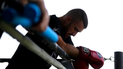 A quick rest after the pad work with MMA coach Khusan Majlimov.