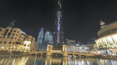 Dubai's Burj Khalifa is lit up in support for Australia. Chris Whiteoak / The National