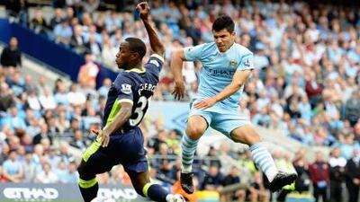 Sergio Aguero fires home the first of his hat-trick of goals against Wigan Athletic.