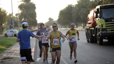 Half-Marathon and 10k runners race around the Abu Dhabi Equestrian Club. Nicole Hill / The National