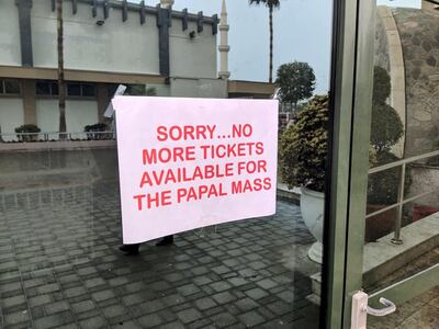 A sign at St Joseph's Church in Abu Dhabi. Daniel Sanderson / The National