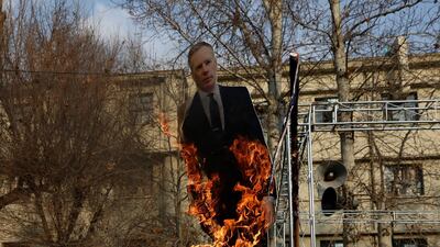 Rob Macaire was detained on Saturday after briefly attending a candlelight vigil that turned into a protest. AP