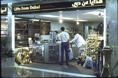 Passengers shop at a duty-free store in Dubai International Airport in 1987. Thomas Hartwell / Getty