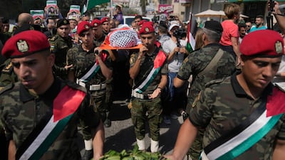 A Palestinian honour guard carries the body of Aysenur Ezgi Eygi, 26, who was fatally shot by Israeli soldiers during an anti-settlement protest in the occupied West Bank, during a funeral procession in Nablus. AP