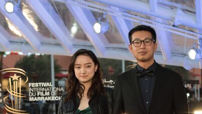 Chinese actors Zhang Tongxi and Yanhui Wang attend the premiere of 'Noura's Dream' during the 18th Marrakech International Film Festival on November 30, 2019. AFP