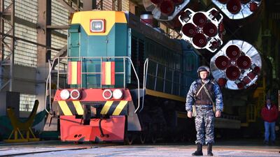The Soyuz-FG booster rocket with Soyuz MS-15 spacecraft attached leaves its hanger and begins a slow three hour train journey to Gagarin's Start - the launch pad that first man in space Yuri Gagarin blasted off from in 1961 - on Monday morning. Vyacheslav Oseledko / AFP