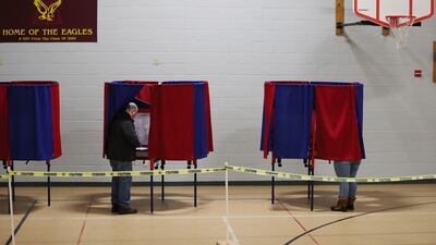 Voters cast their ballots in a voting booth setup in a community centre on February 11, 2020 in Manchester, New Hampshire. Joe Raedle / Getty Images/ AFP