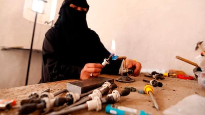 Safa al-Faqih crafts a stone in the old city of the capital, Sanaa, on April 18, 2018. Mohammed Huwais / AFP Photo