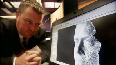A 3D facial recognition programme is demonstrated during the Biometrics 2004 exhibition and conference in London. Ian Waldie / Getty Images