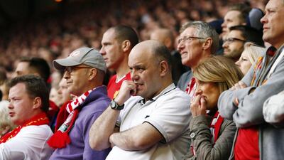 Liverpool fans watch their team during their English Premier League soccer match against Chelsea at Anfield in Liverpool, northern England April 27, 2014. REUTERS/Darren Staples