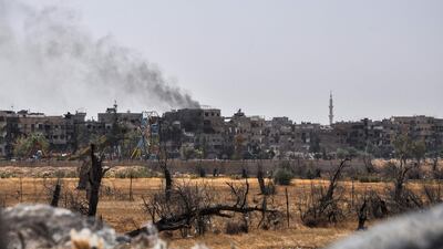 A picture taken during a Syrian army-organised tour shows a view of the Eastern Ghouta town of Douma. Stringer / AFP