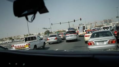 An ambulance tries to make its way through traffic to respond to a call behind Al Twar Centre in Dubai.