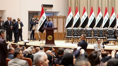 Iraqi politicians at a parliamentary session to vote in the new government. Reuters