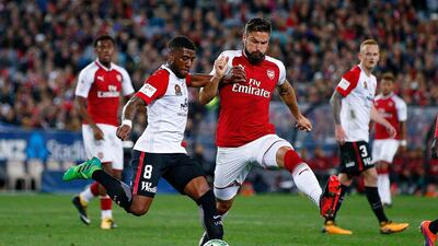 Roly Bonevacia of the Wanderers is challenged by Olivier Giroud of Arsenal during their matchat ANZ Stadium on July 15, 2017 in Sydney, Australia.