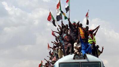 Sudanese civilians from other provinces ride on the train to join in the celebrations of the signing of the Sudan's power sharing deal, that paves the way for a transitional government, and eventually elections, following the overthrow of long-time leader Omar al-Bashir in Khartoum, Sudan. REUTERS/Mohamed Nureldin Abdallah