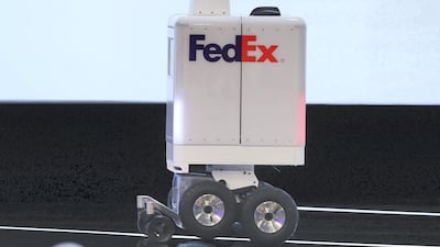 FedEx has teamed up with Dubai's Roads and Transport Authority to unveil its new autonomous delivery robot at Dubai World Congress for Self-Driving Transport. Chris Whiteoak / The National