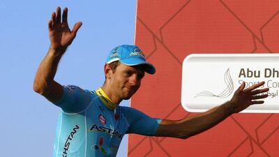 Tanel Kangert, of Team Astana, gestures on the podium after winning the third stage of the Abu Dhabi Tour. Karim Sahib / AFP