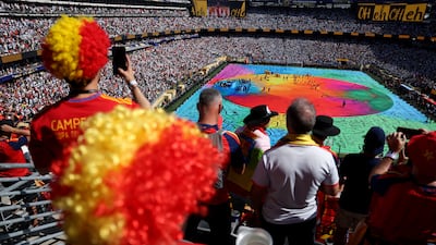 Spain fans watch on as Shakira and Burna Boy perform during the show. Reuters