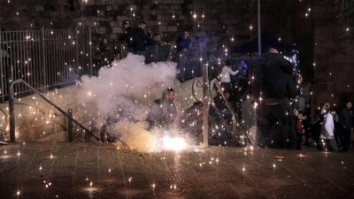 An anti-riot flare explodes outside the Damascus Gate. AFP
