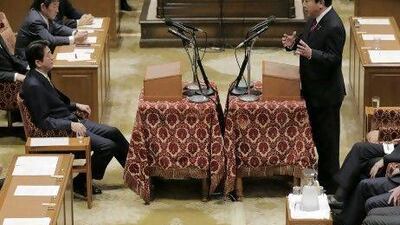 Japanese prime minister Yoshiko Noda, right, debates with Japan's main opposition Liberal Democratic Party president Shinzo Abe in Parliament on Wednesday.
