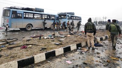 Indian soldiers examine the debris after an explosion in Lethpora in south Kashmir's Pulwama district. REUTERS