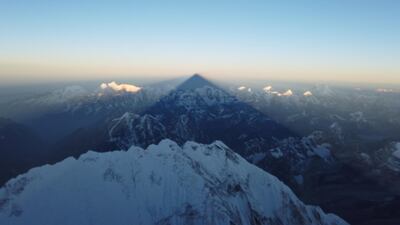 Shadow of Everest is cast on the mountains during sunrise. AFP