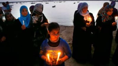 Palestinians at the Gaza City port show their support for the Gaza-bound ship from Lebanon at a demonstration yesterday.