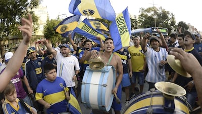 A band plays as supporters of Boca Juniors gather at Lezama park to cheer for their team before their trip to Madrid. AFP