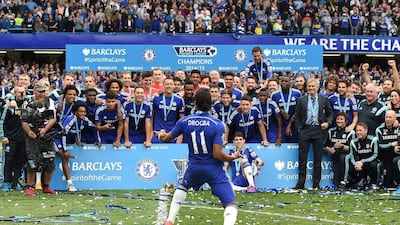 Chelsea player Didier Drogba celebrates with teammates as champions after their final Premier League match of the season on Sunday. Andy Rain / EPA / May 24, 2015
