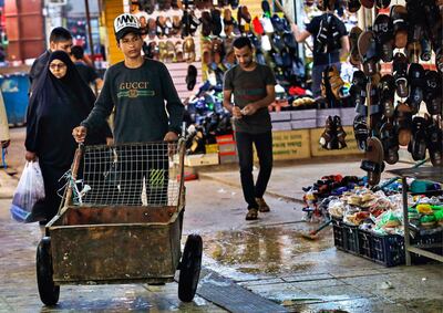 People shop at old Basra market, Iraq, Wednesday, Oct. 21, 2020. Iraq is in the throes of an unprecedented liquidity crisis, as the cash-strapped state wrestles to pay public sector salaries and import essential goods while oil prices remain dangerously low. AP Photo