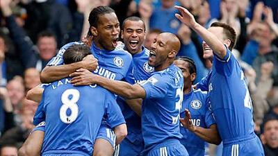 Didier Drogba, top left, celebrates a goal against Wigan in Chelsea's 8-0 hammering during the final game of last season that helped the Londoners seal a third Premier League crown.