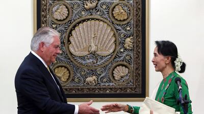 Myanmar leader Aung San Suu Kyi, right, shakes hands with visiting US secretary of state Rex Tillerson after their press conference at the foreign ministry office in Naypyitaw, on November 15, 2017. Aung Shine Oo / AP