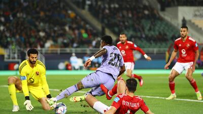 : Vinicius Junior of Real Madrid is challenged by Metwaly Mahmoud of Al Ahly. Getty Images