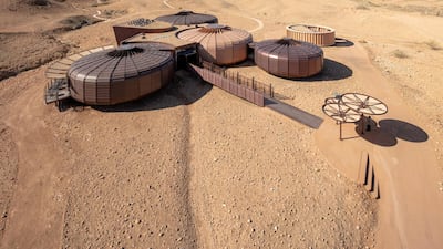 The facility can be seen from an outdoor trail. Courtesy of Hopkins Architects