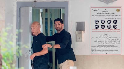 Former Israeli prime minister Ehud Olmert, left, 71, leaves the Maasyahu prison on July 2, 2017 in Ramla, who was freed from prison after being granted parole in a corruption case that reduced his sentence by a third. Jack Guez/AFP Photo