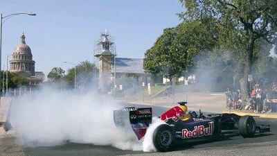 Red Bull Formula One car as the driver, David Coulthard, does a series of doughnuts during the making of a promotional video in Austin, Texas.