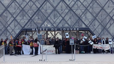Protesters and students from art and culture schools block the entrance to the Louvre Museum. Reuters