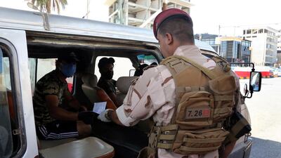 Iraqi soldiers control motorists at a checkpoint in Baghdad's Mansur district, Iraq. EPA