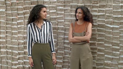 Sisters Tessa and Tara Sakhi in front of their work 'Letters from Beirut' in the Giardini in Venice. The work gives a voice to those in Lebanon.
