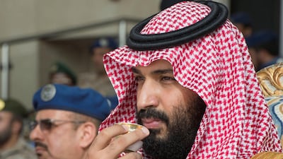 Saudi Arabia's Crown Prince Mohammed bin Salman watches a graduation ceremony at King Faisal Air Academy in Riyadh on February 21, 2018. Bandar Algaloud / Courtesy of Saudi Royal Court via Reuters