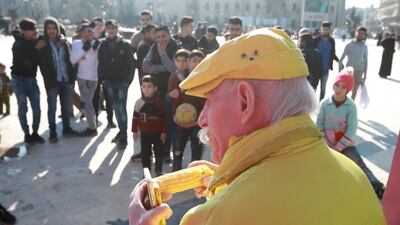 Zakkour eats a cob of corn