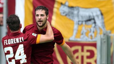 Roma's Mattia Destro, right, celebrates with teammate Alessandro Florenzi after scoring during their Serie A win over Cagliari on Sunday. Alessandro Di Meo / EPA / September 21, 2014